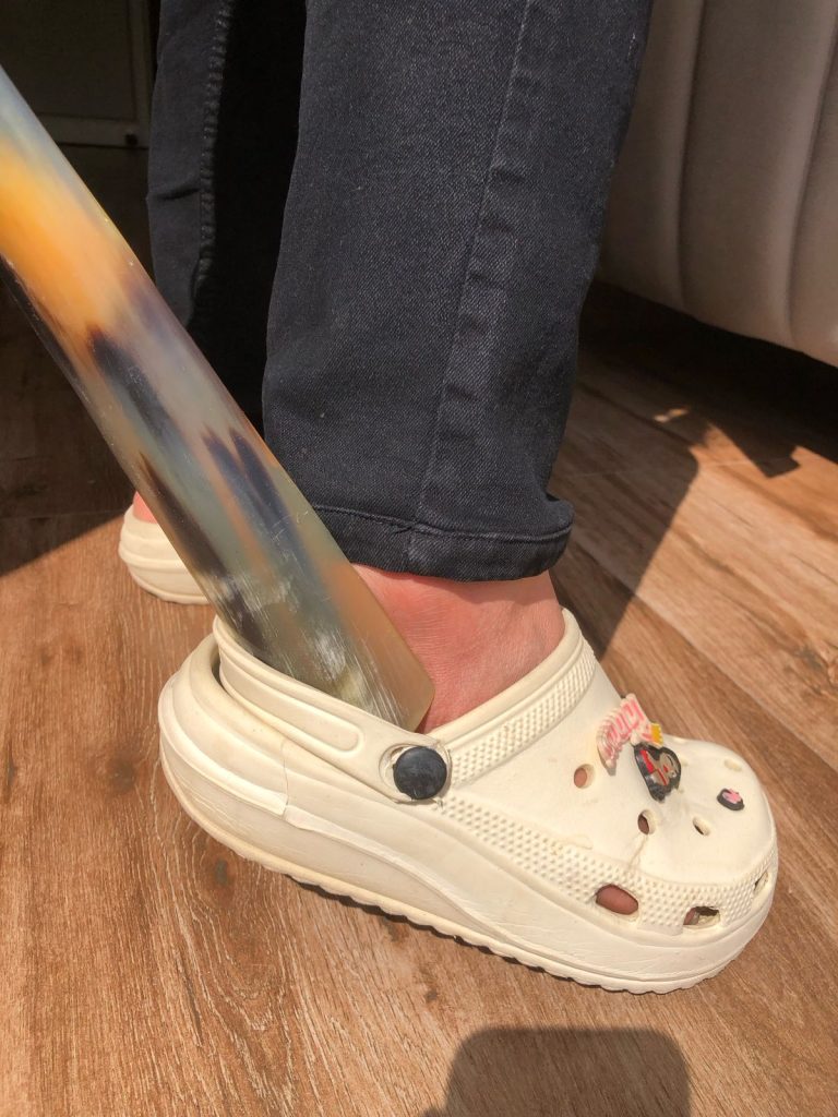 "Slip into your shoes with ease and keep them looking new with a durable shoehorn – the perfect tool for preserving your footwear’s shape and comfort."